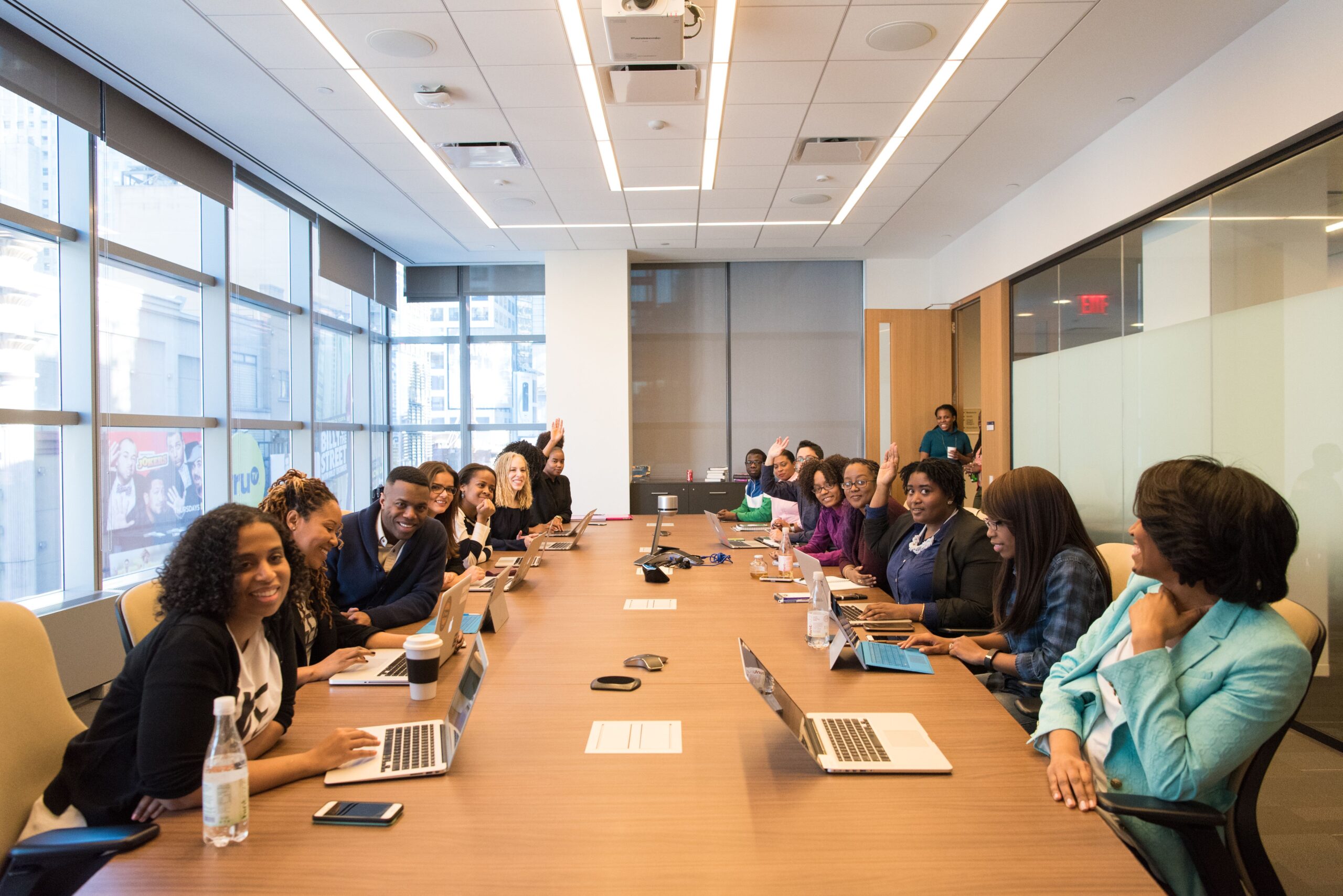 Professional Development Essentials: Building Skills for Career Advancement A diverse group of professionals engaging in a productive meeting around a conference table.